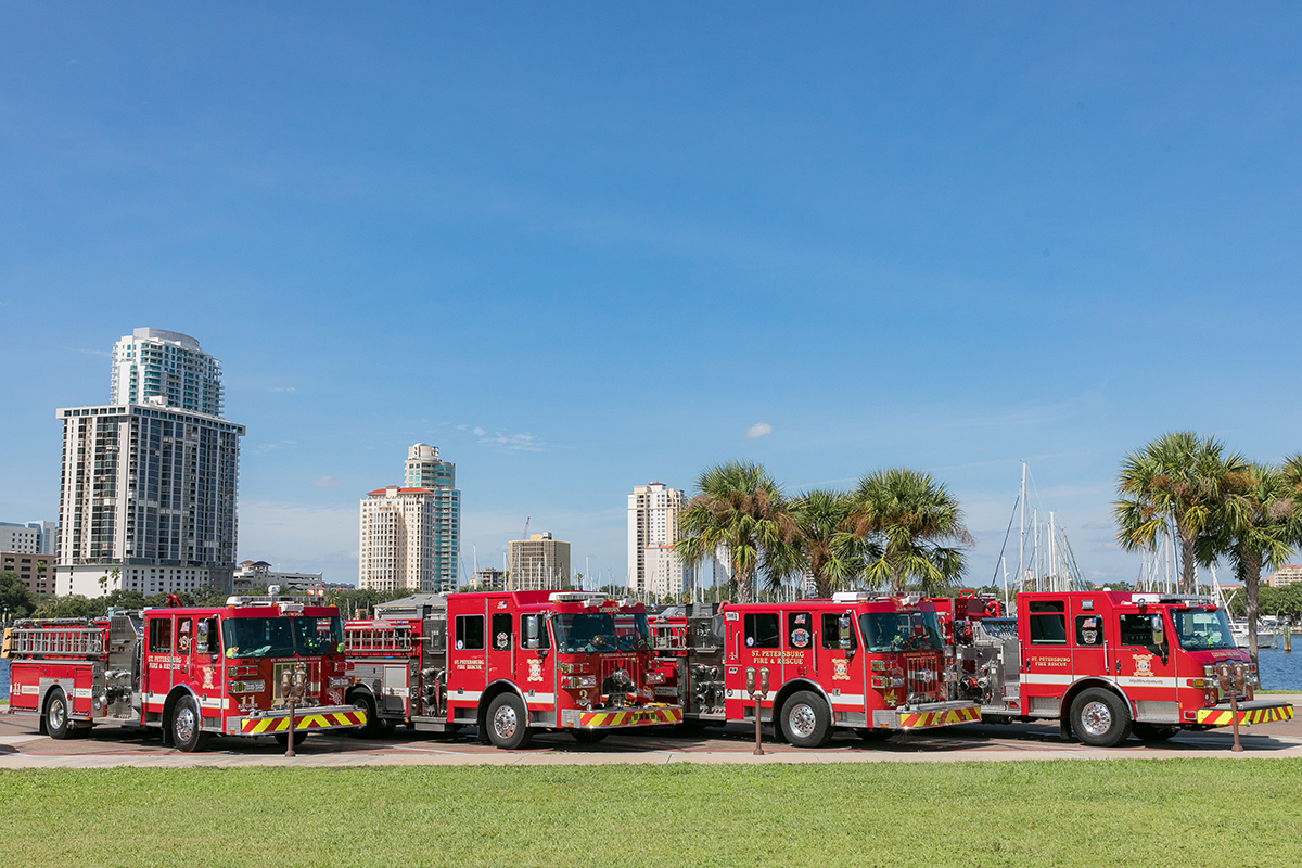4 fire trucks in front of waterfront