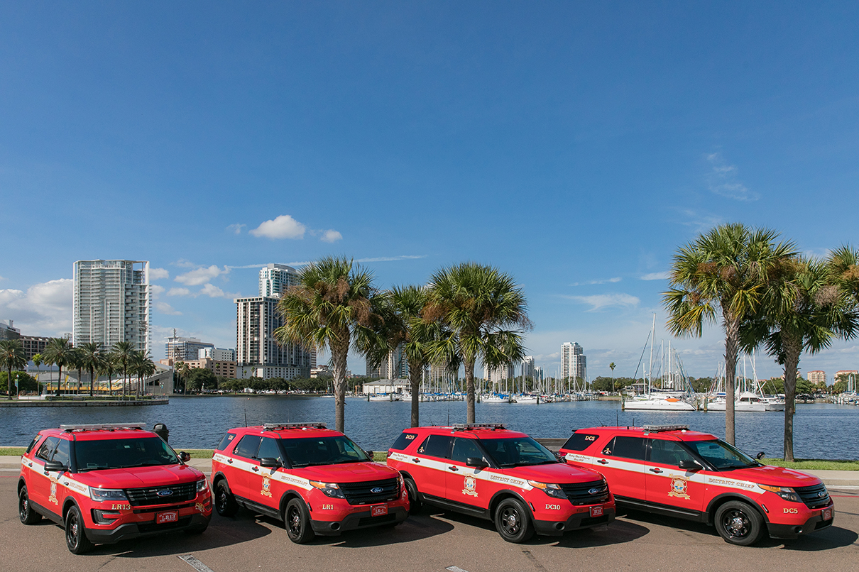 4 chief vehicles in front of waterfront